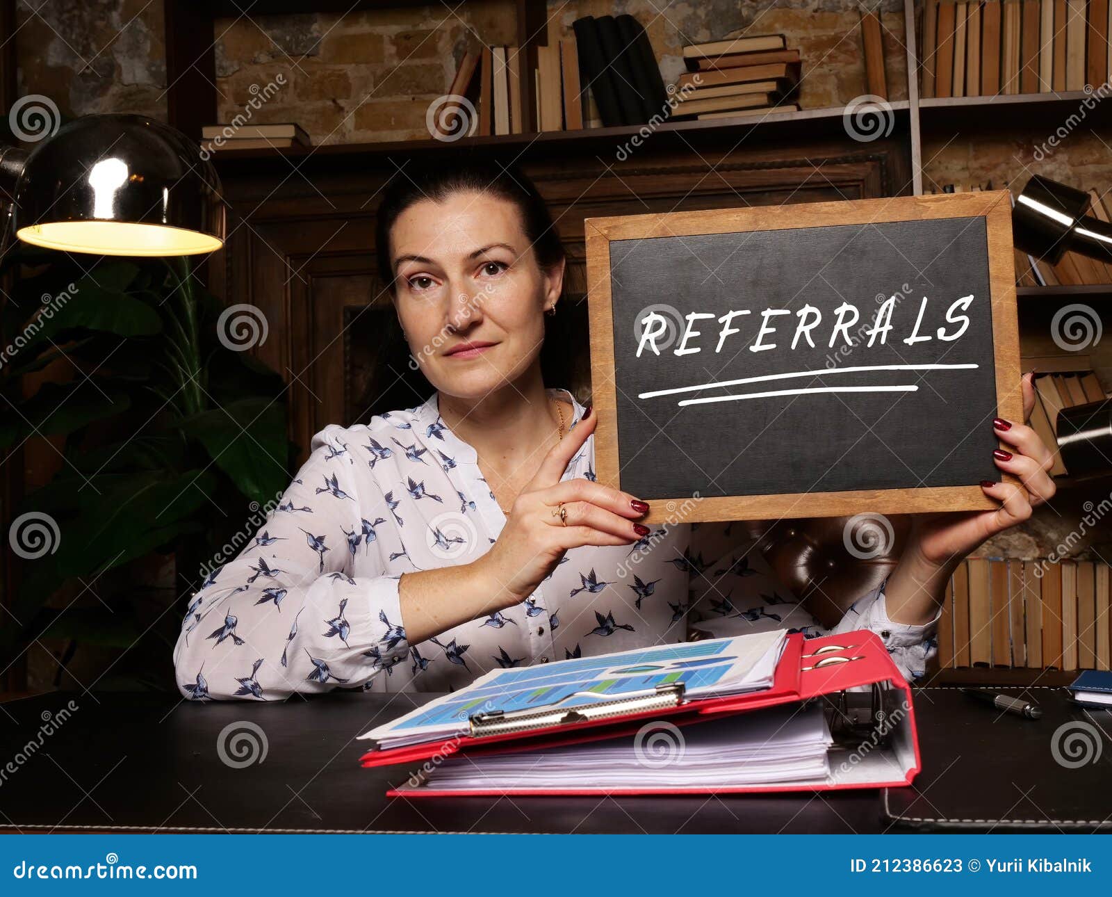 Business Concept Meaning REFERRALS with Phrase on Chalkboard Stock