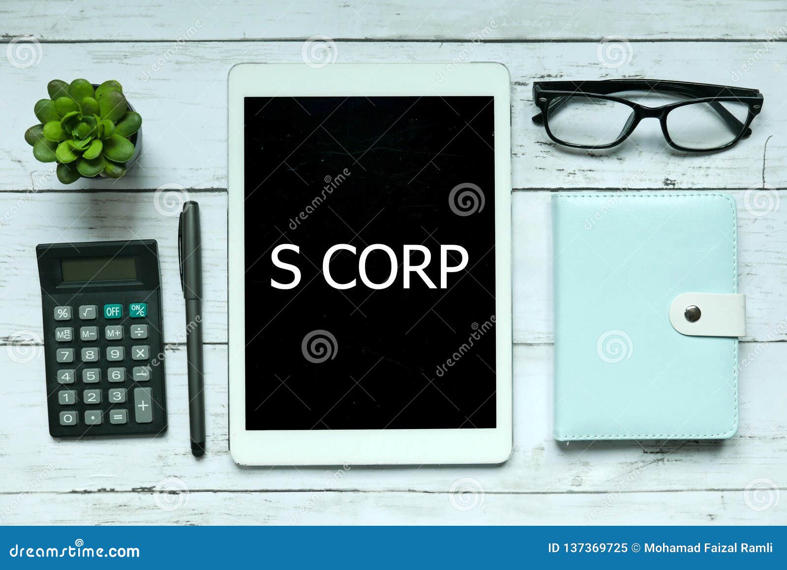 business concept. top view of plant,calculator,glasses,pen,notebook and tablet written with s corp on white wooden background.