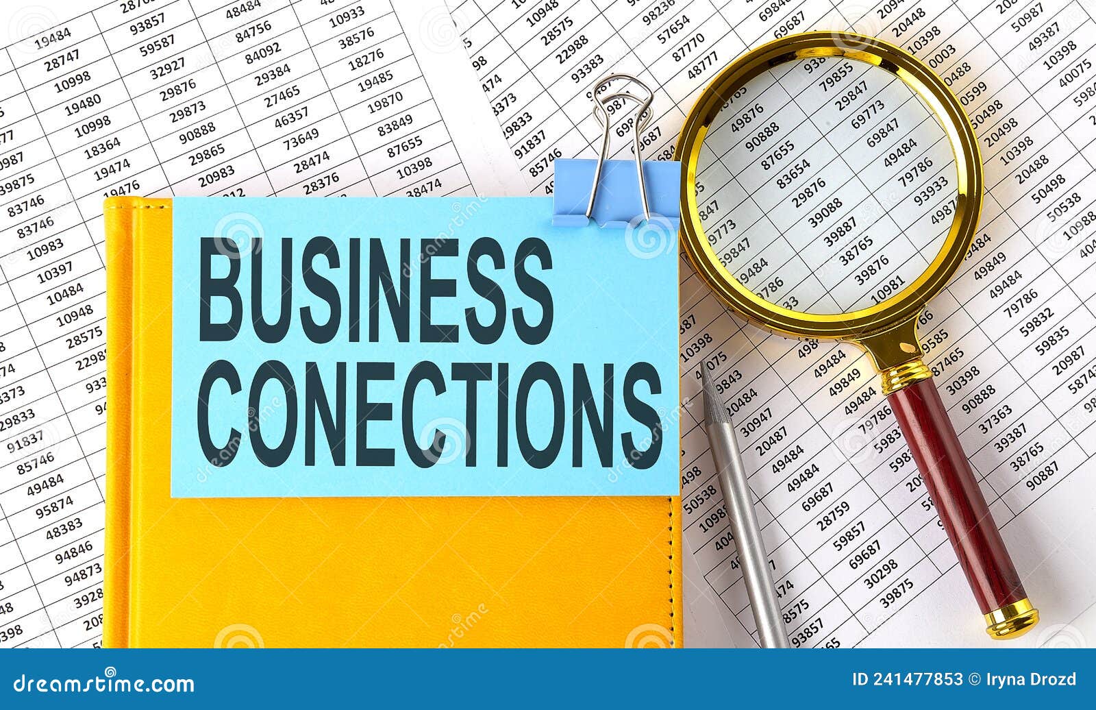 business conections text on sticker on the notebook with magnifier and chart. business concept