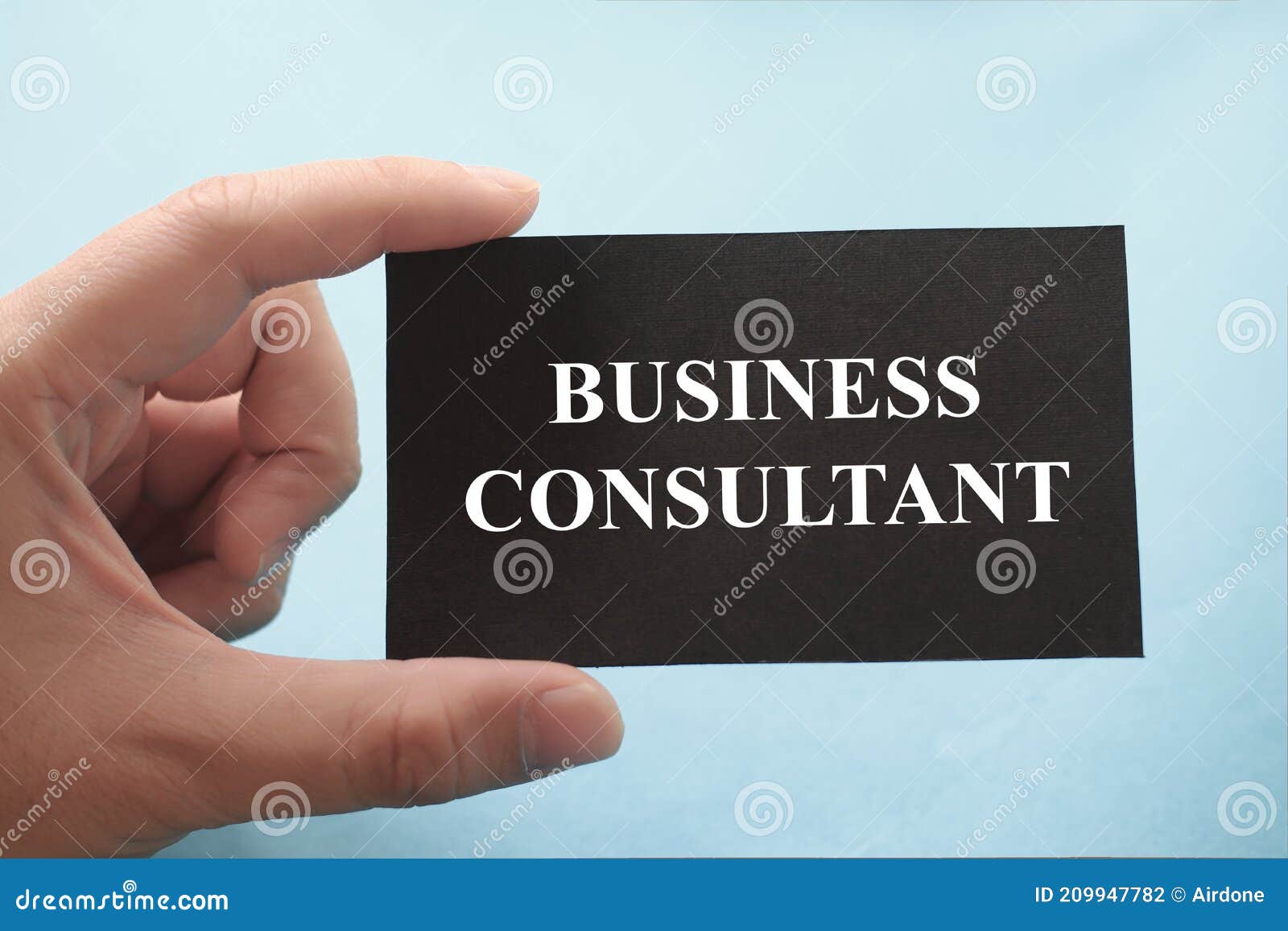 business consultant, text words typography written on paper against blue background, life and business motivational inspirational