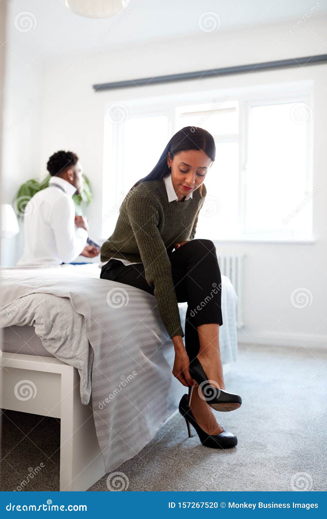 Business Couple In Bedroom Getting Ready For Work