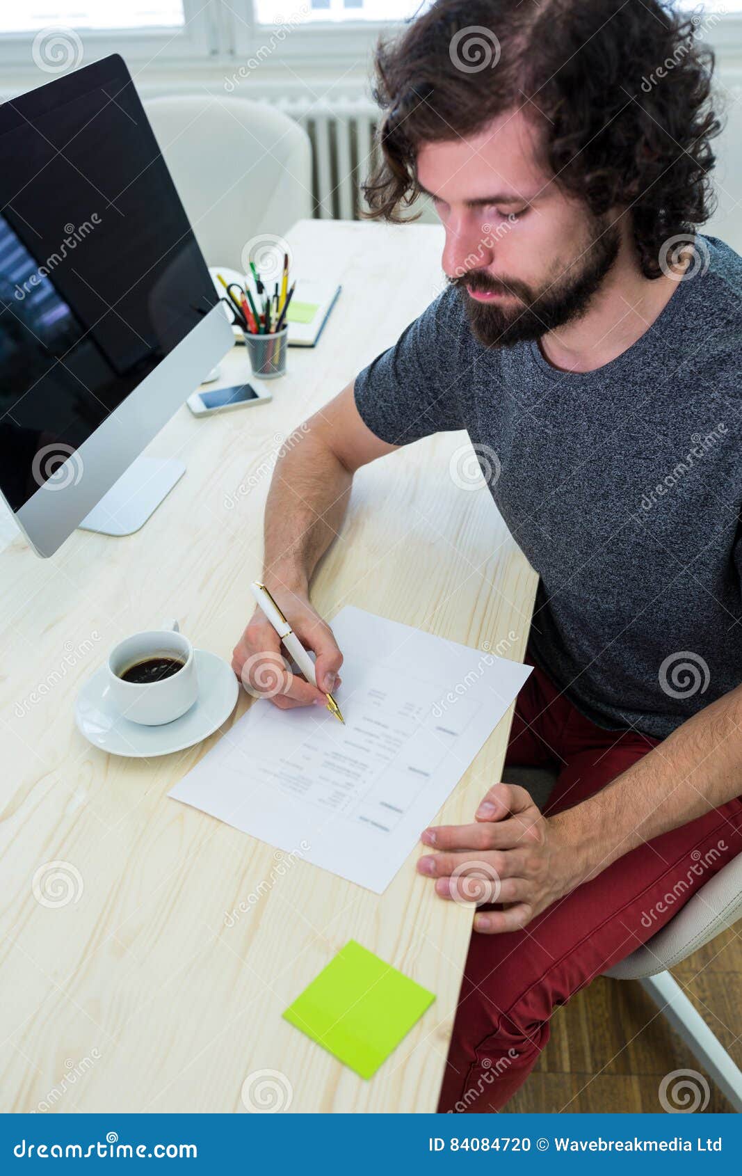 Business Executive Writing on a Document Stock Photo Image of