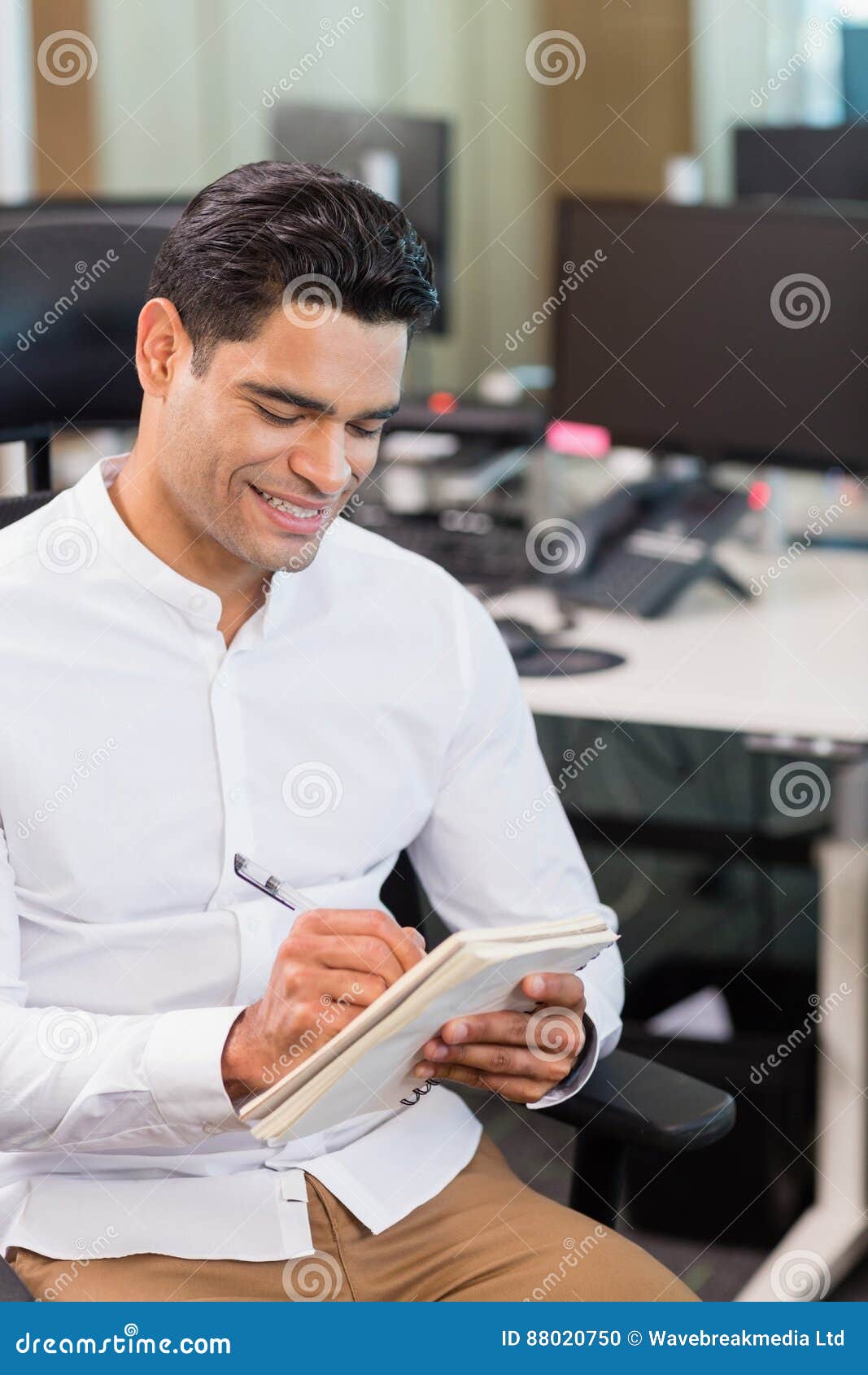 Business Executive Writing on Notebook in Office Stock Photo Image of