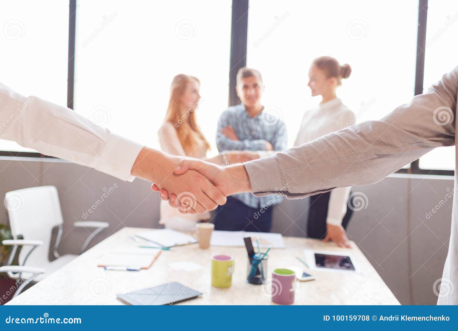 Business handshake and business people.Vintage tone Retro filter effect,soft focus,low light. Two confident business man shaking hands during a meeting in the office, success, dealing, greeting and partner concept.