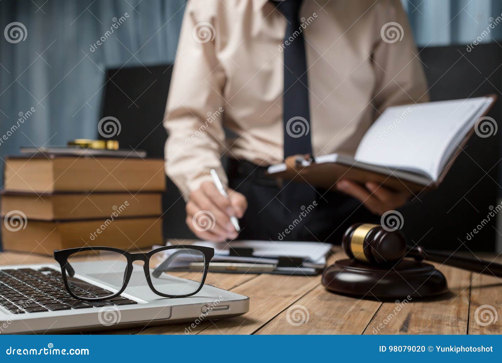 business lawyer working hard at office desk workplace with book