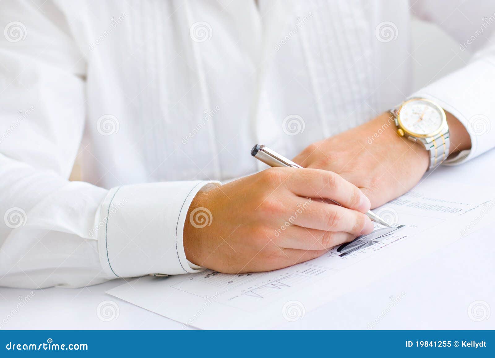 business man analysing graph and making notes
