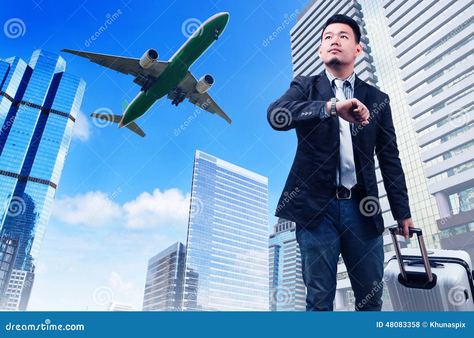 business man and big belonging luggage watching to sky and hand