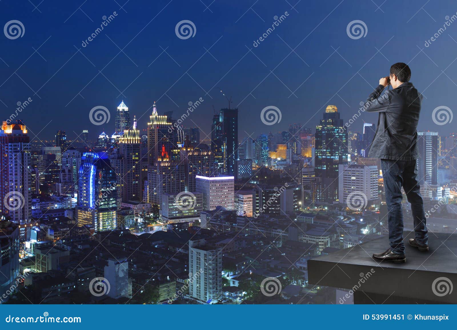 business man and binocular spying watching to another building u