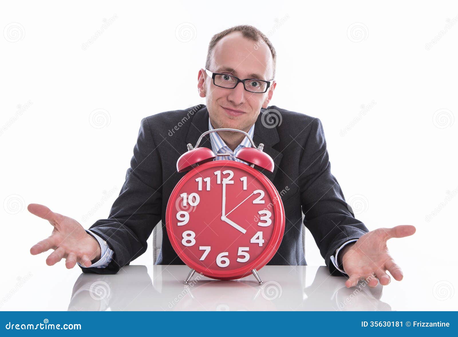 Businessman trying to stop time Stock Photo by ©kantver 69891211