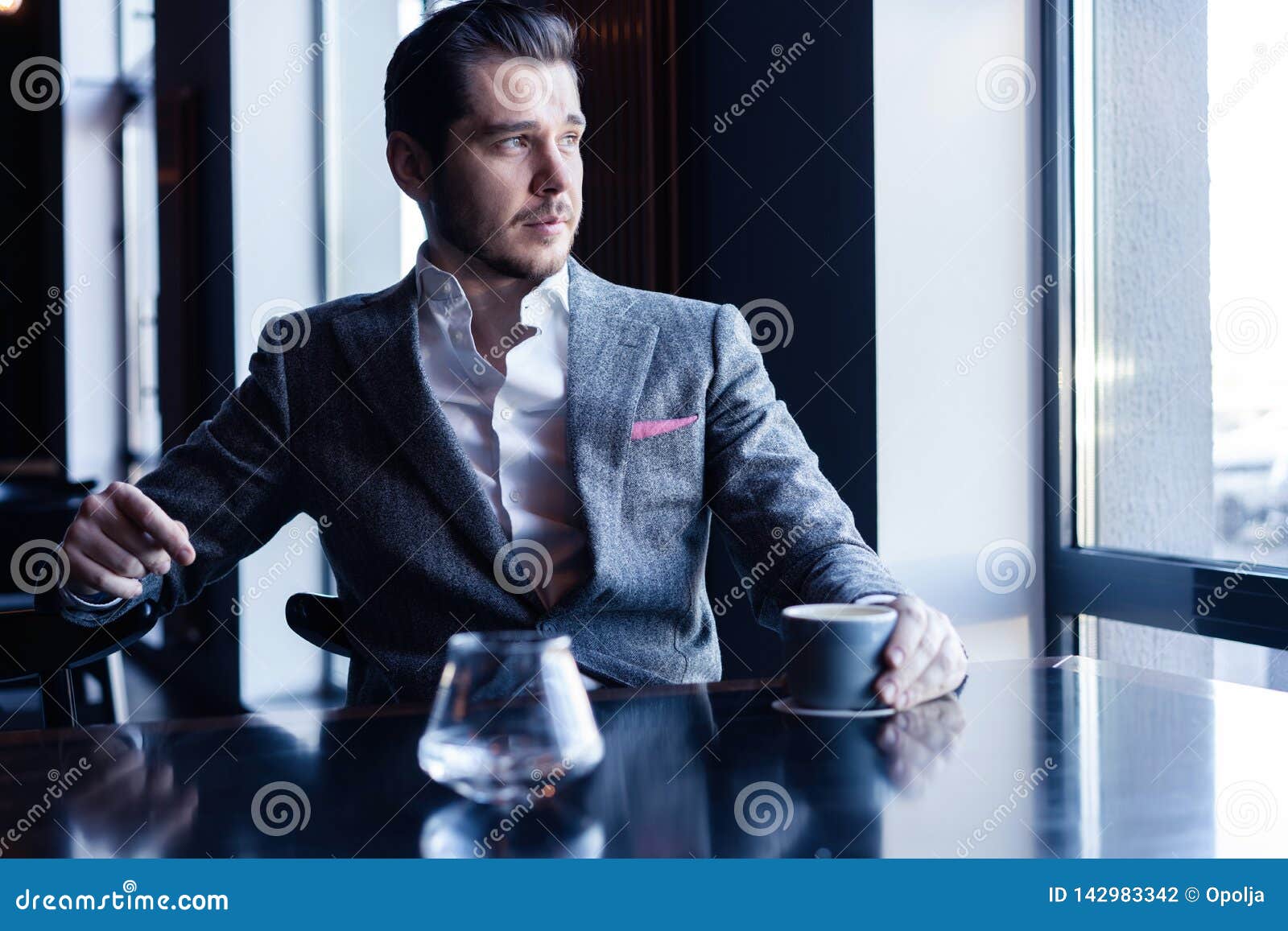 Business Man Drinking Coffee in a Cafe Coffee Time. Stock Photo