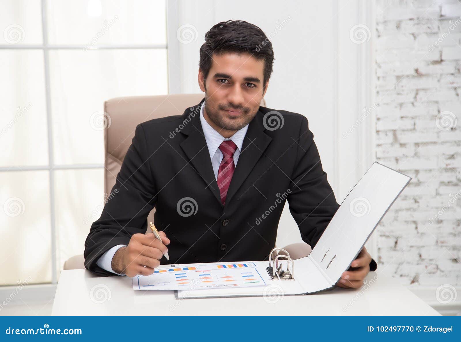 Business Man Executive Writing Notes while Smiling Look at the C Stock