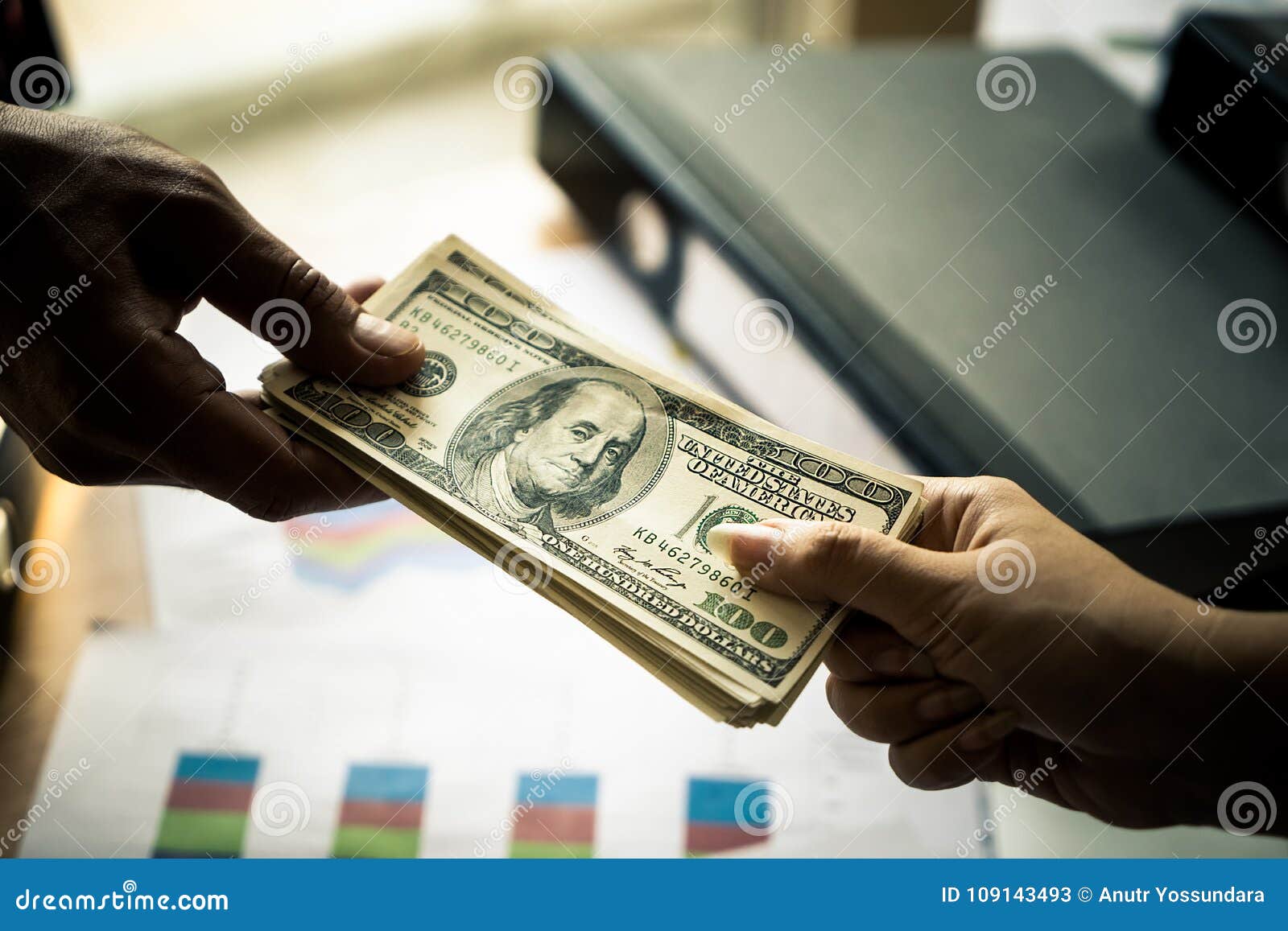business man hands handing money over business meeting
