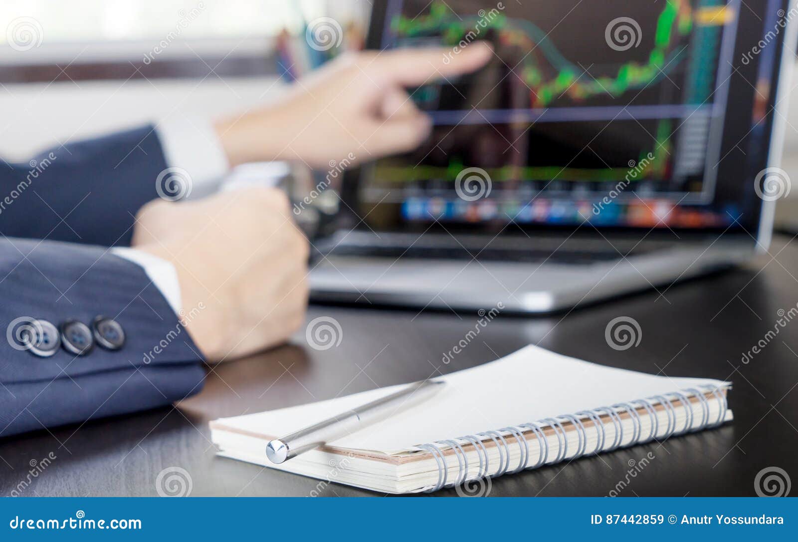 Business Man Happily Pointing at the Stock Trading is Going Up. Stock