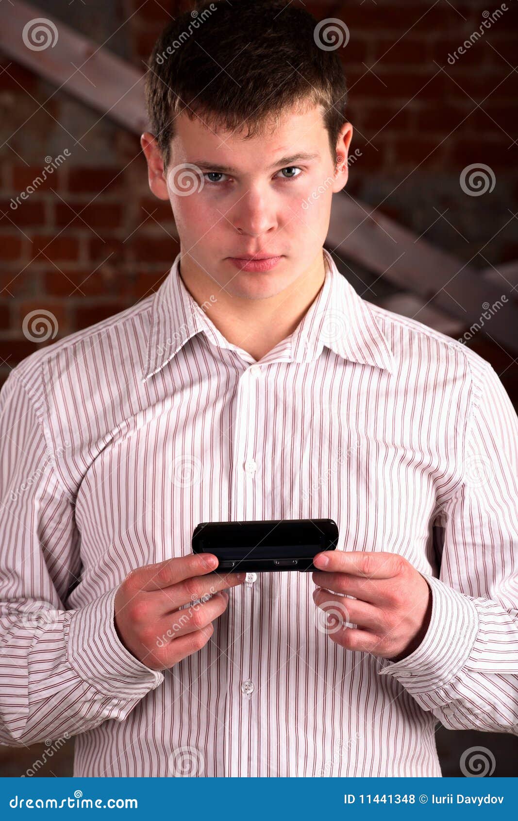 business man holding a mobile communicator