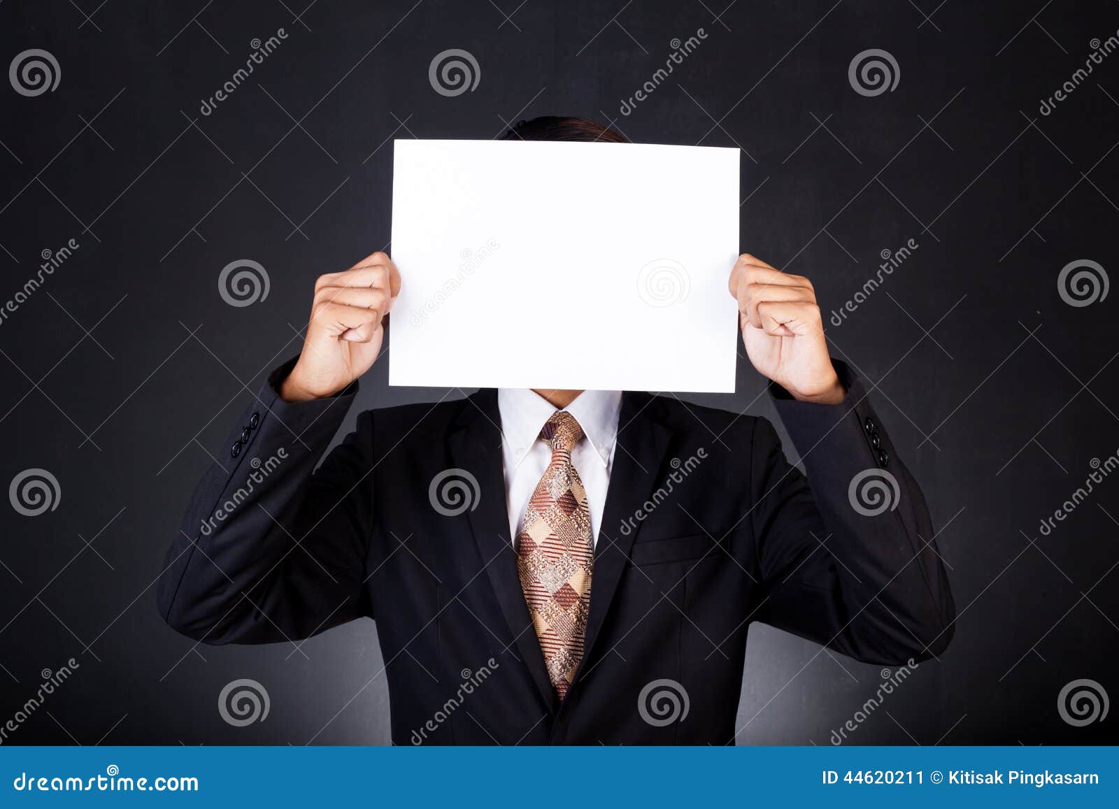 A Business Man Holding a Paper in Front of His Face Stock Image Image