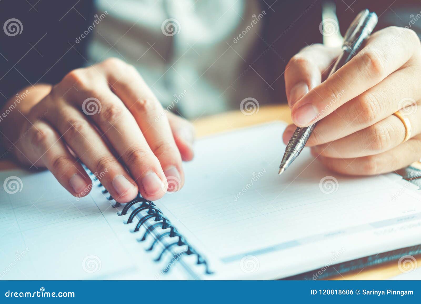 business man holding pen pointing on summary report chart