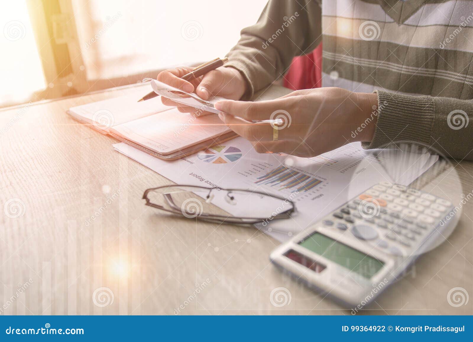 business man pointing on data paper data work on office table with laptop.concept business and finance.