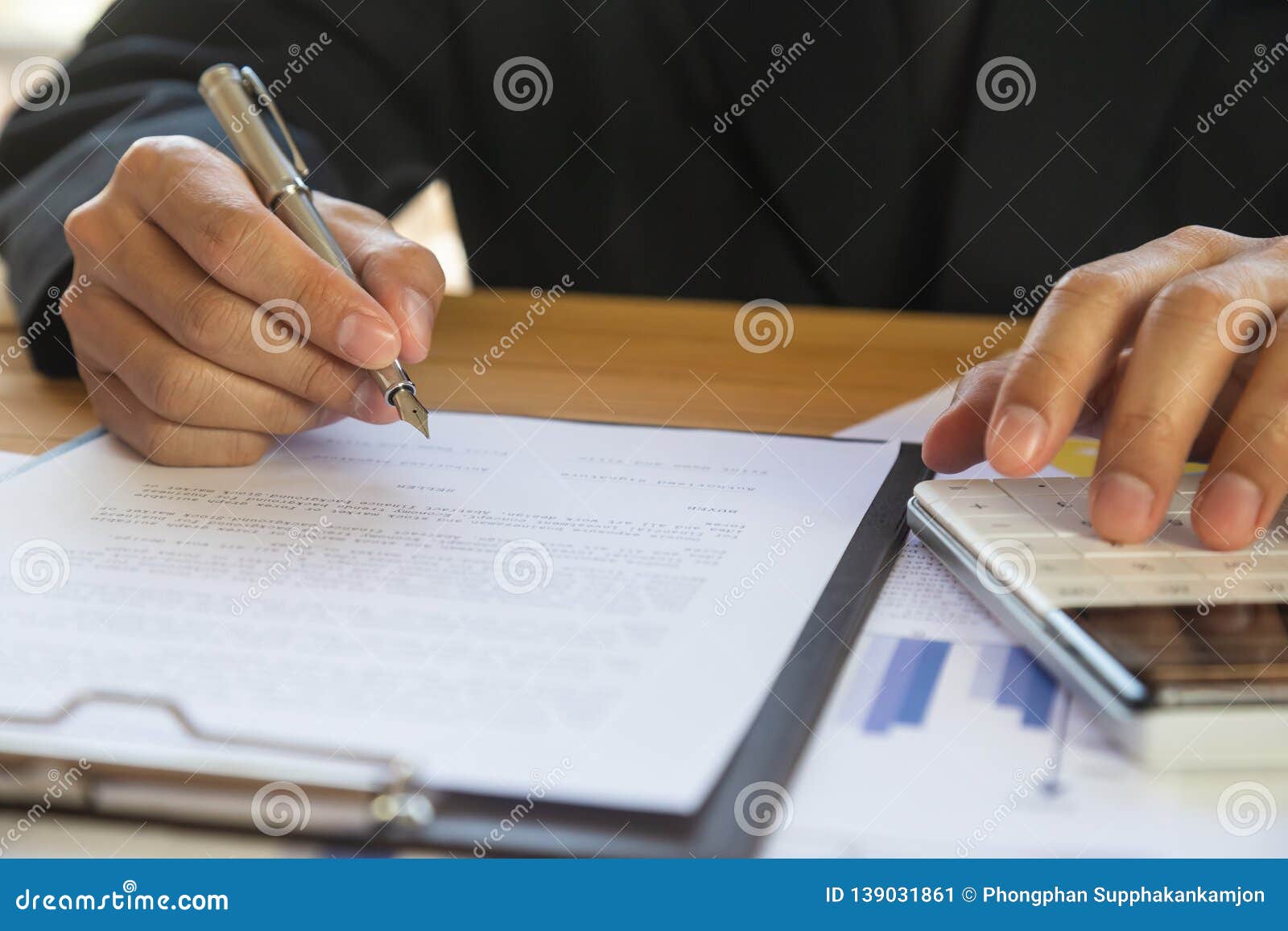 business man signing a contract. owns the business sign personally,director of the company, solicitor. real estate agent holding
