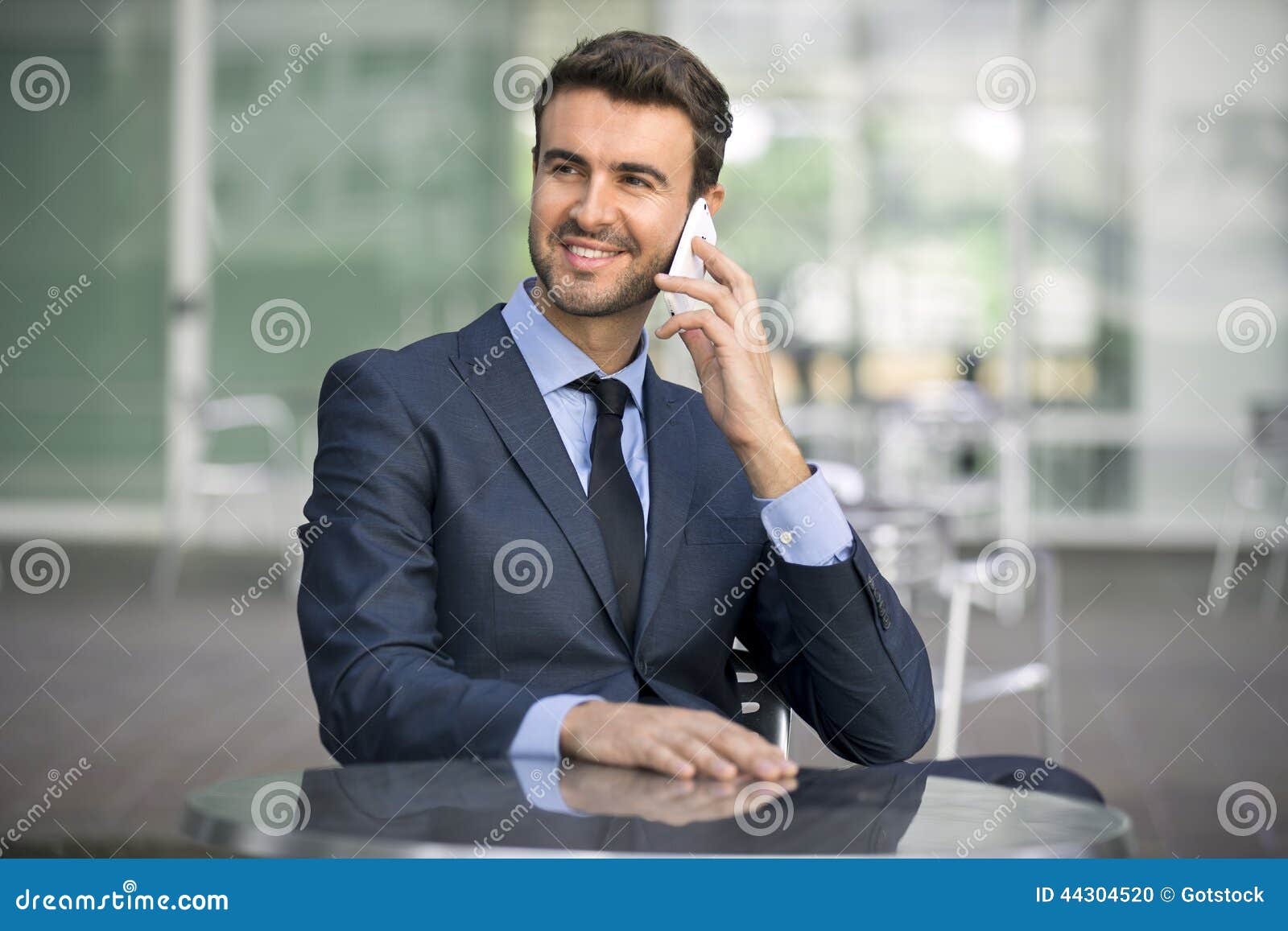 Business Man Sitting Talking on Cell Phone Stock Photo - Image of ...