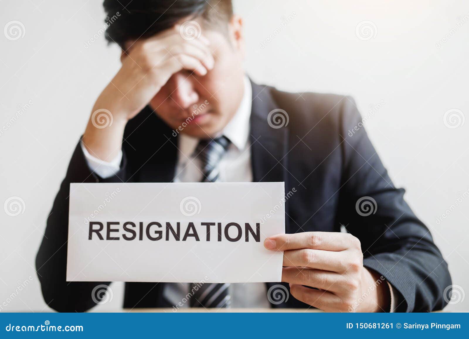 business man stressing with resignation letter for quit a job packing the box and leaving the office , resignation concept