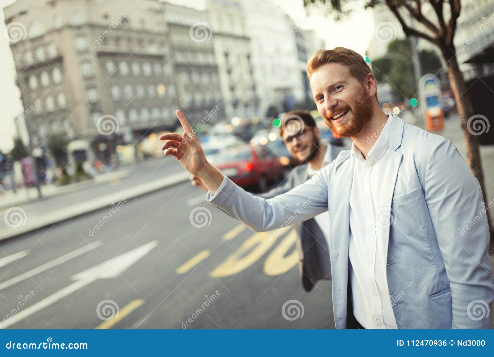 Business Men Hailing a Cab in Busy City Stock Photo - Image of urban ...