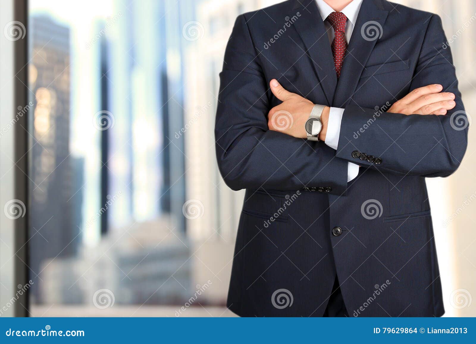 business and office concept - elegant young fashion buisness man in a blue/navy suit