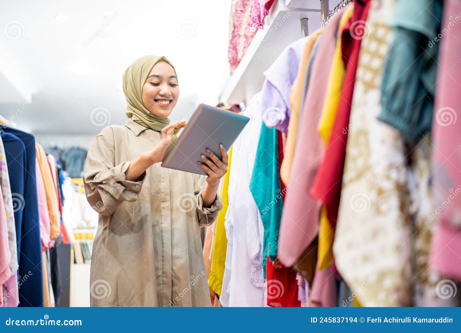 business owner wearing hiijab using a tablet