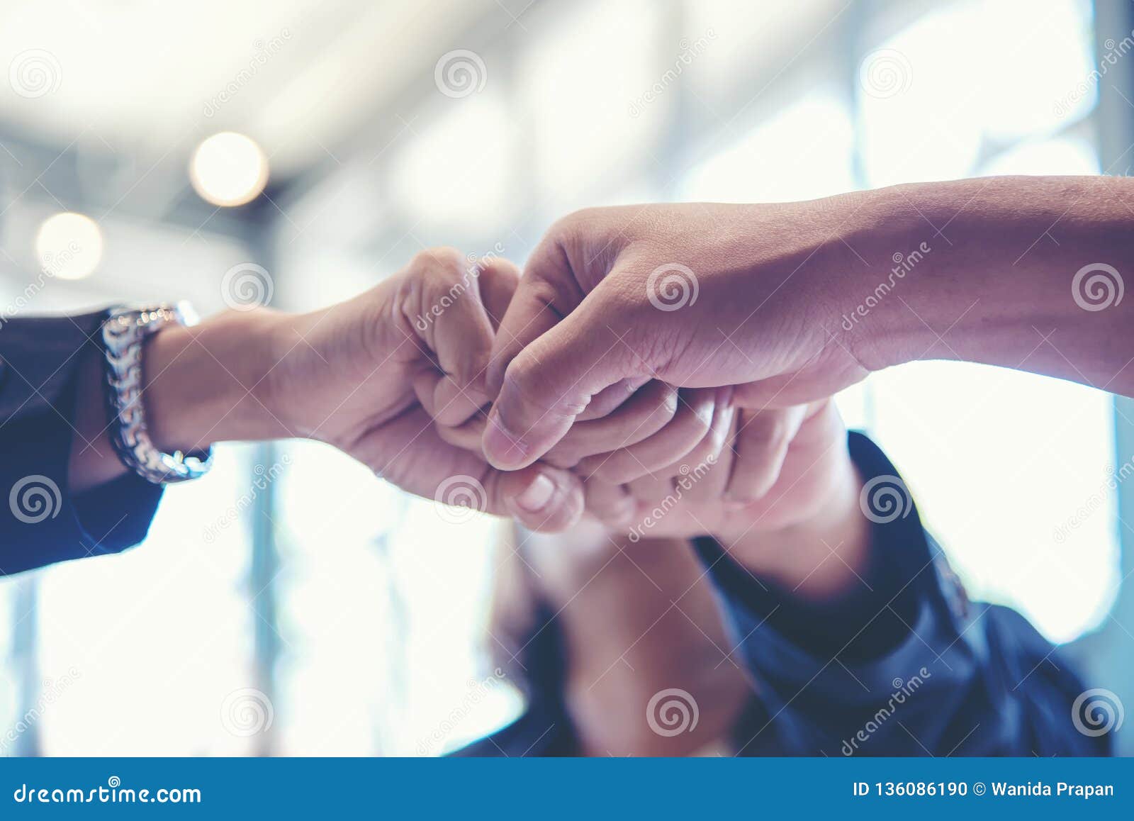 business partner people joining and stack hand together after contract finished meeting.