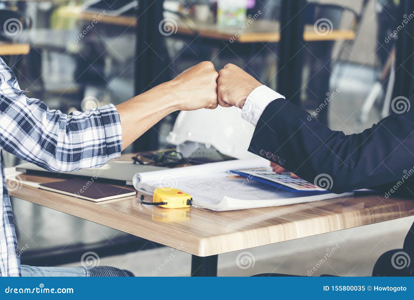 business partners trust in team giving fist bump to greeting start up project contractor.businessman teamwork are partnership in