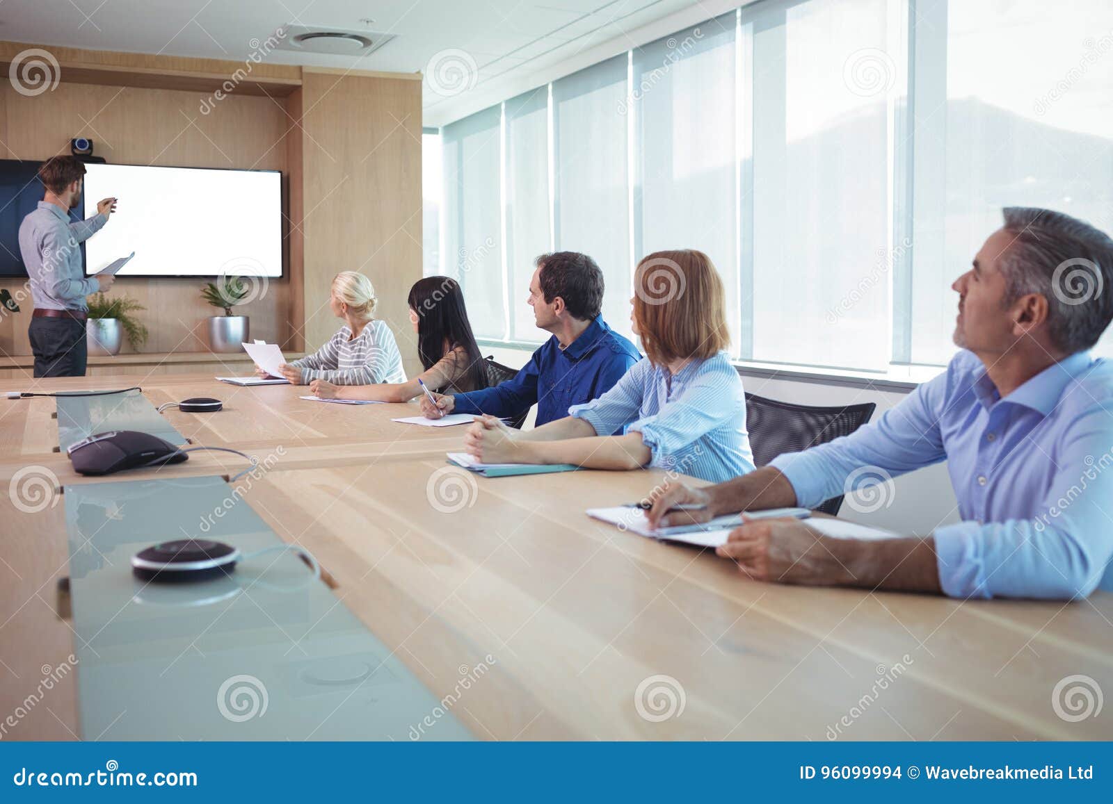 Business People at Conference Table during Meeting Stock Photo - Image