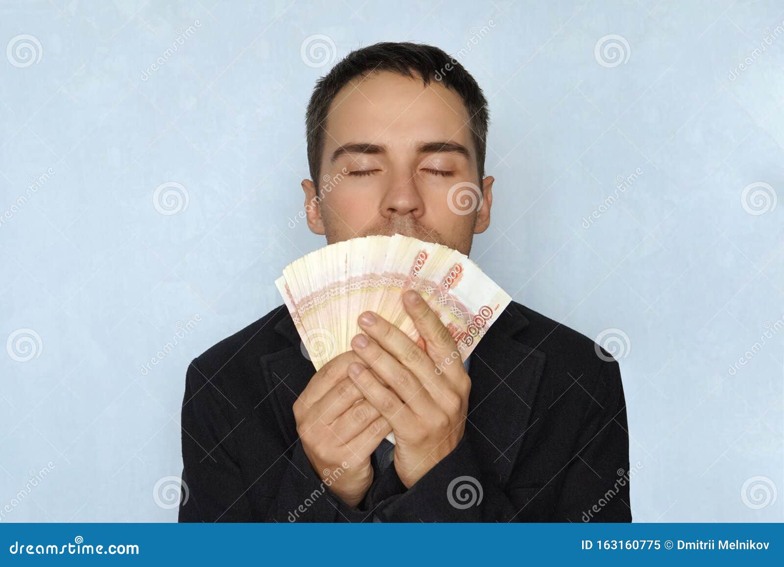 Business People And Finances Concept Businessman Smelling Russian Money The Sweet Smell Of