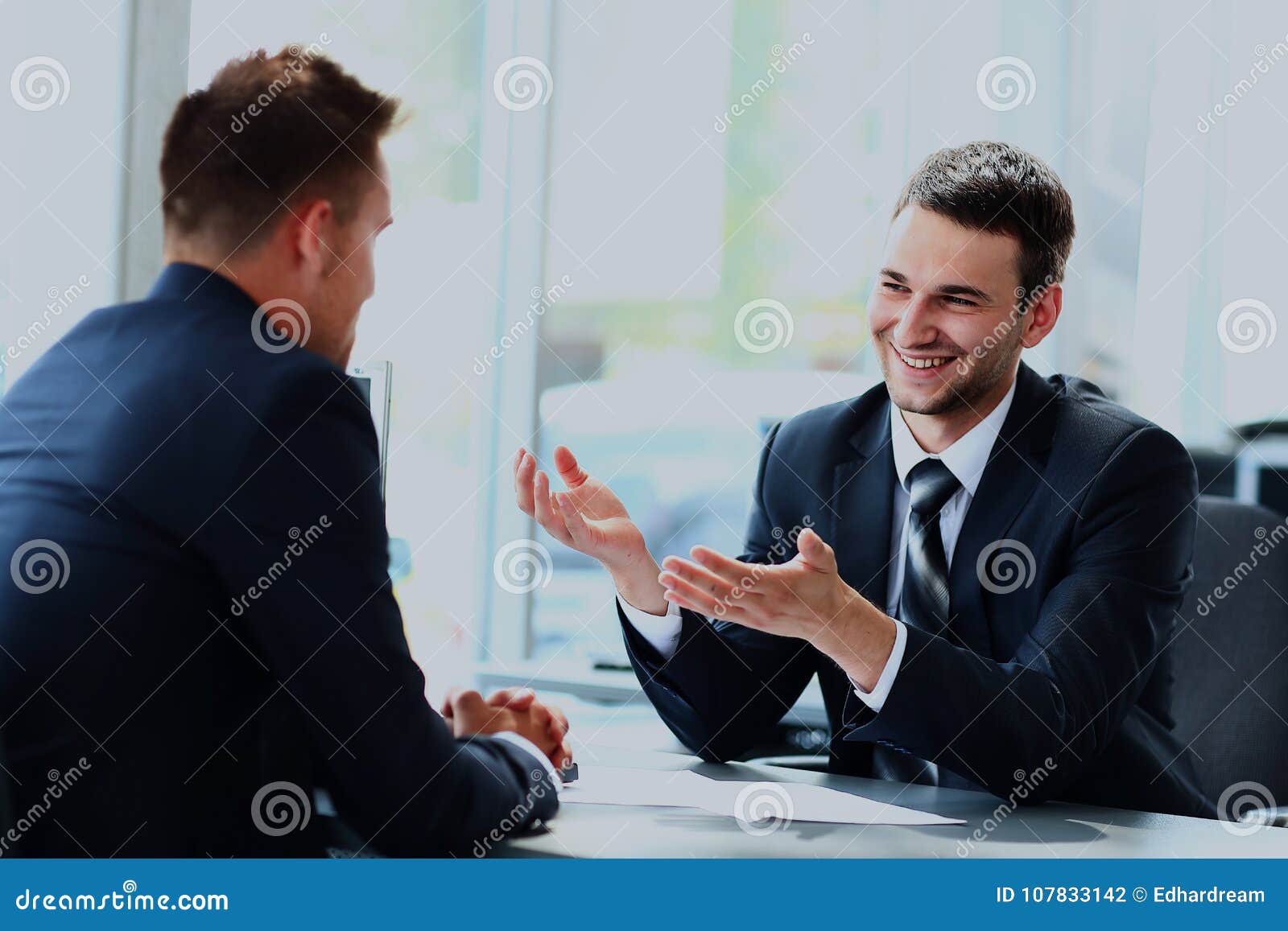 Business People Speaking during Interview in Their Office. Stock Photo