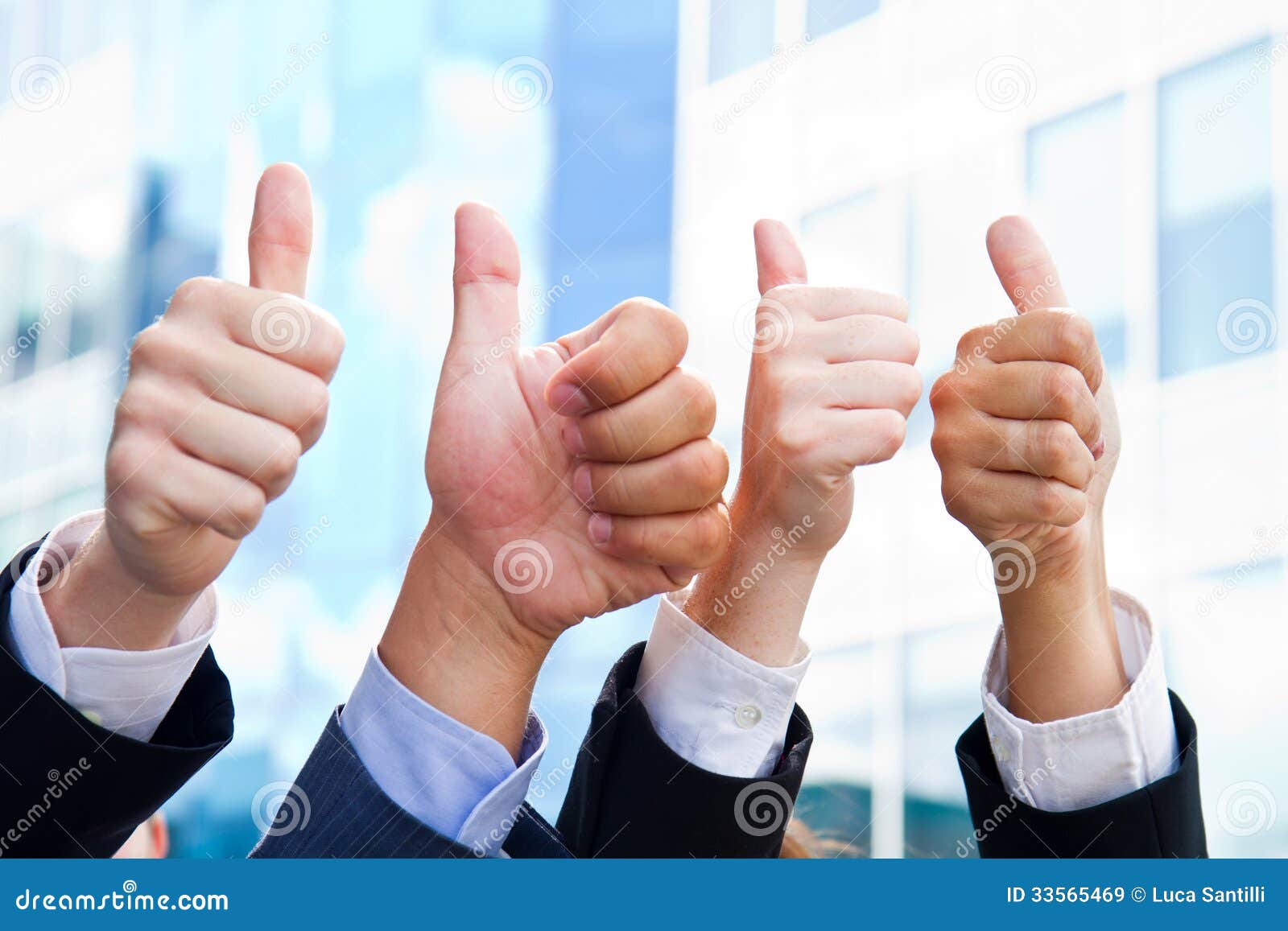 Some Business People with Thumbs Up