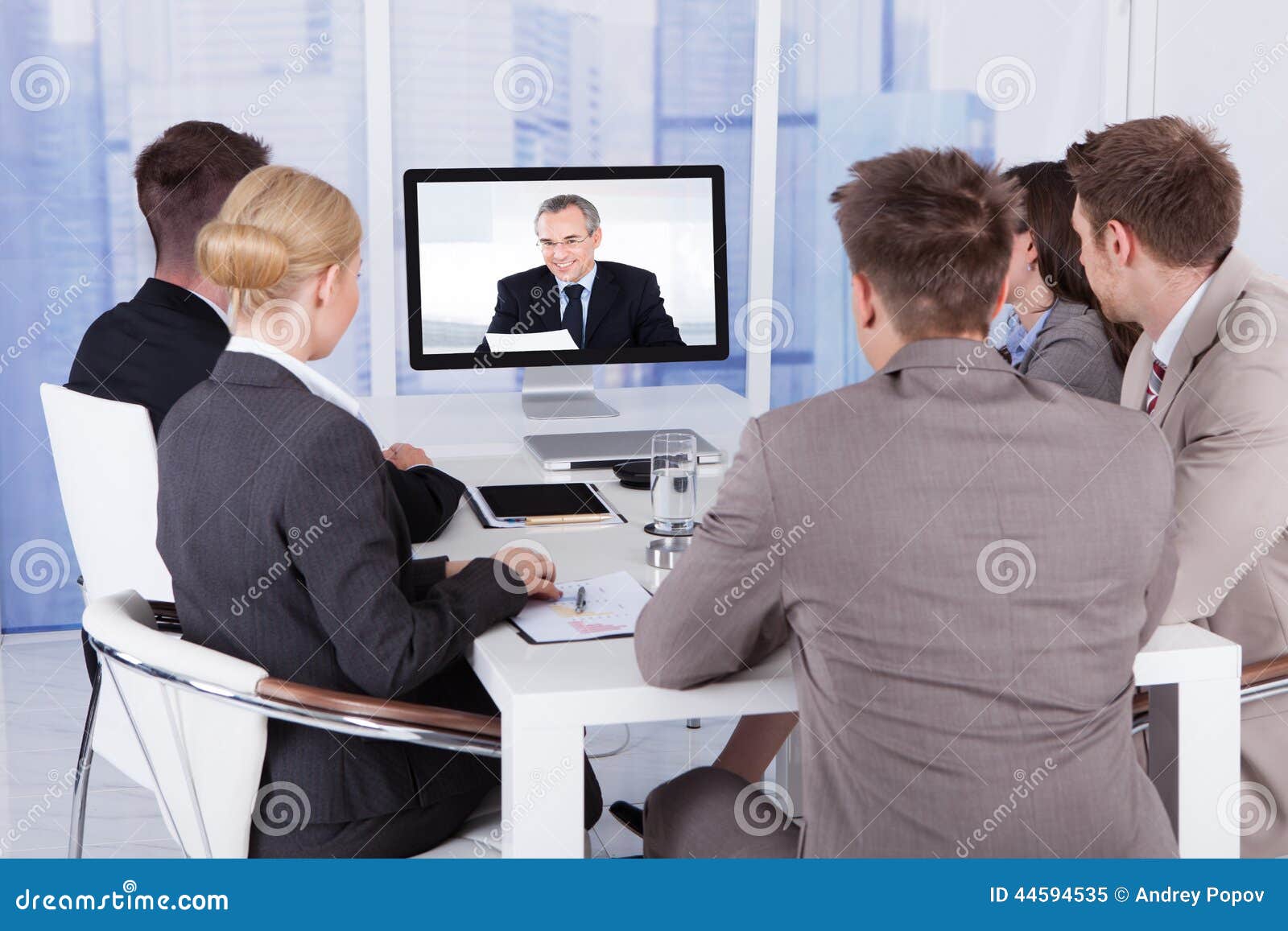 Business People in Video Conference at Table Stock Image Image of