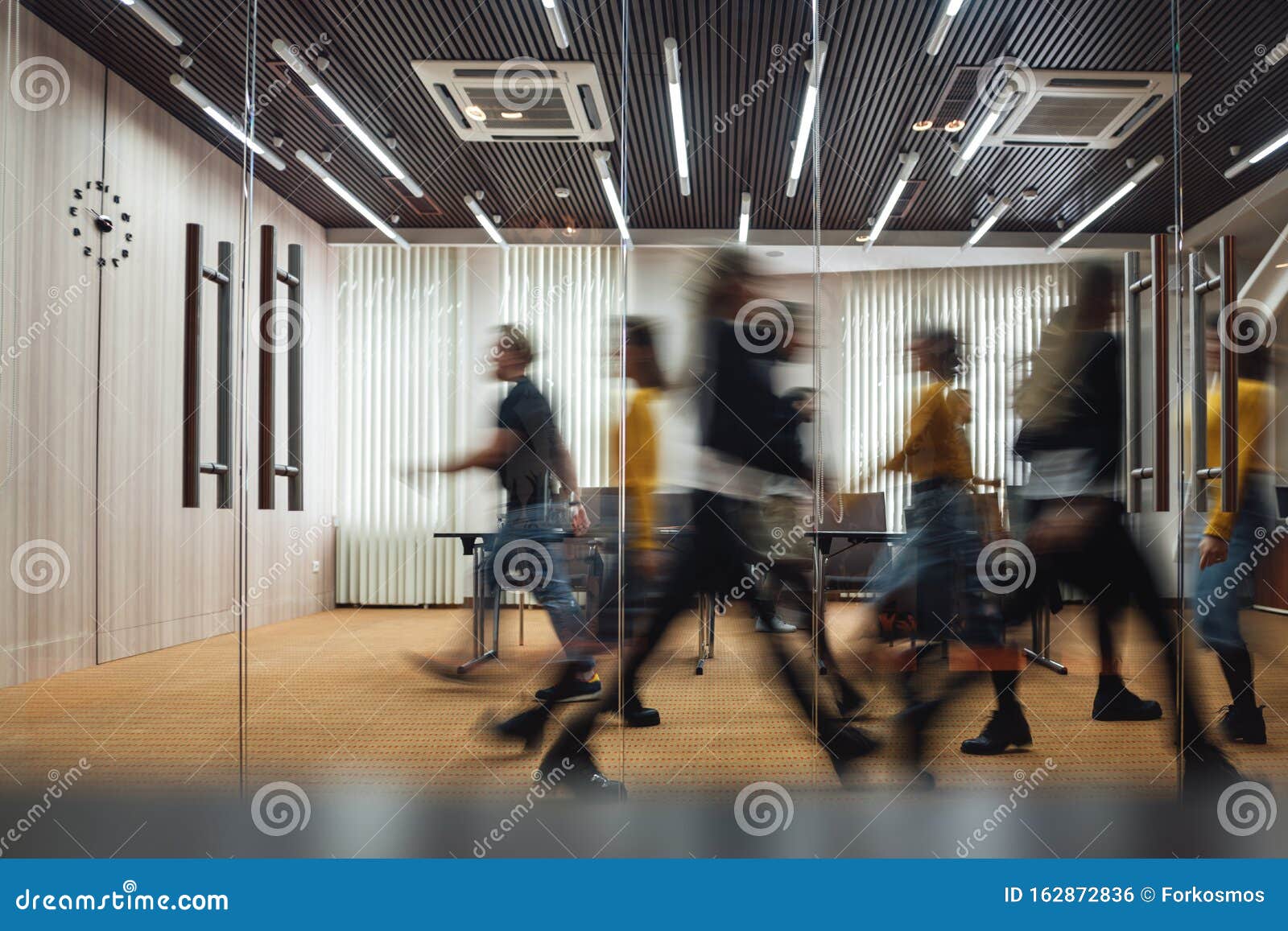 business people walking at modern open space. motion blur. concept
