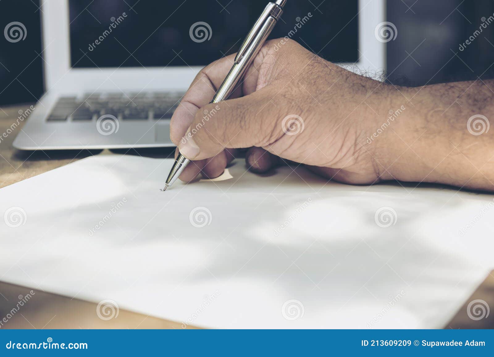 business people writing on peice of empty paper