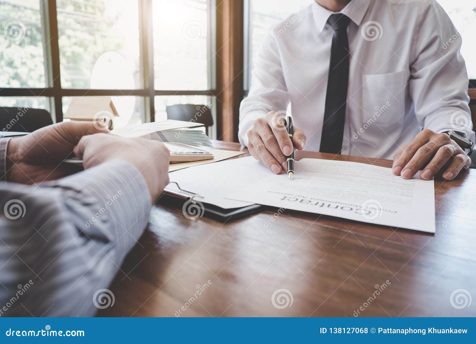 business signing a contract buy - sell house, man sign a home insurance policy on home loans, insurance agent analyzing about home