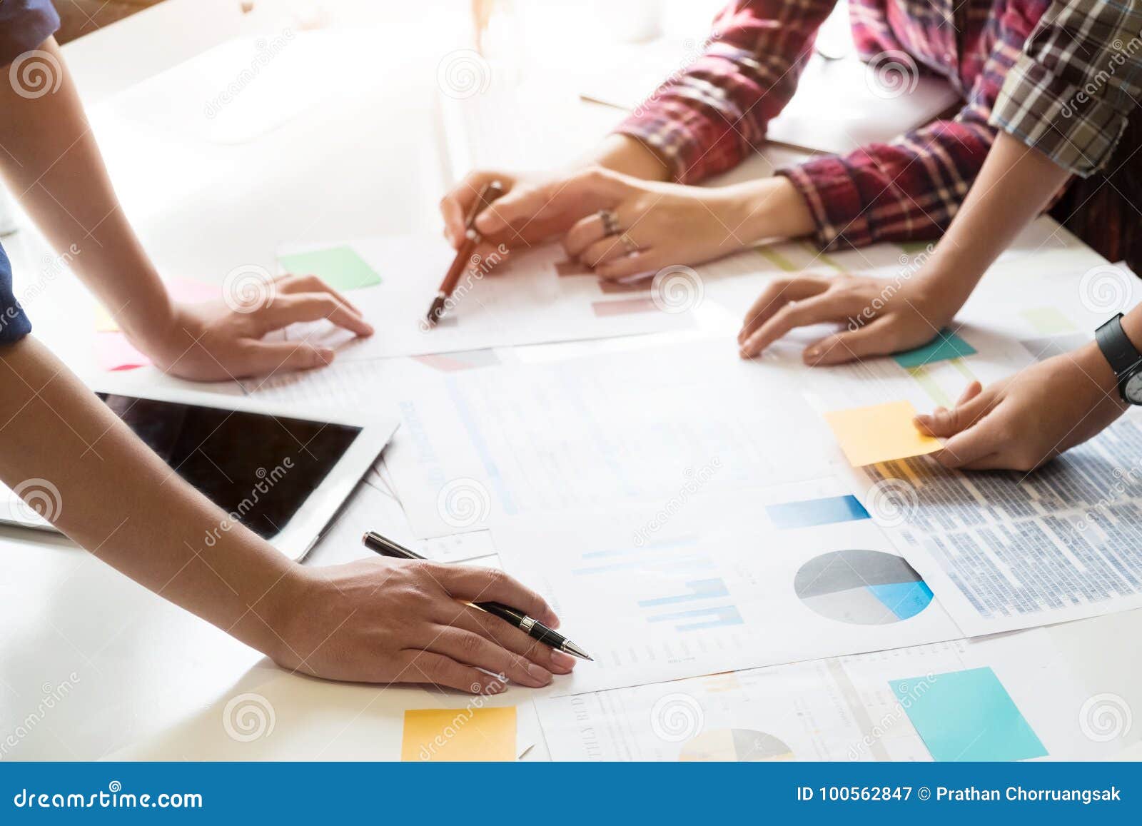business team adviser analysis financial data on paper denoting