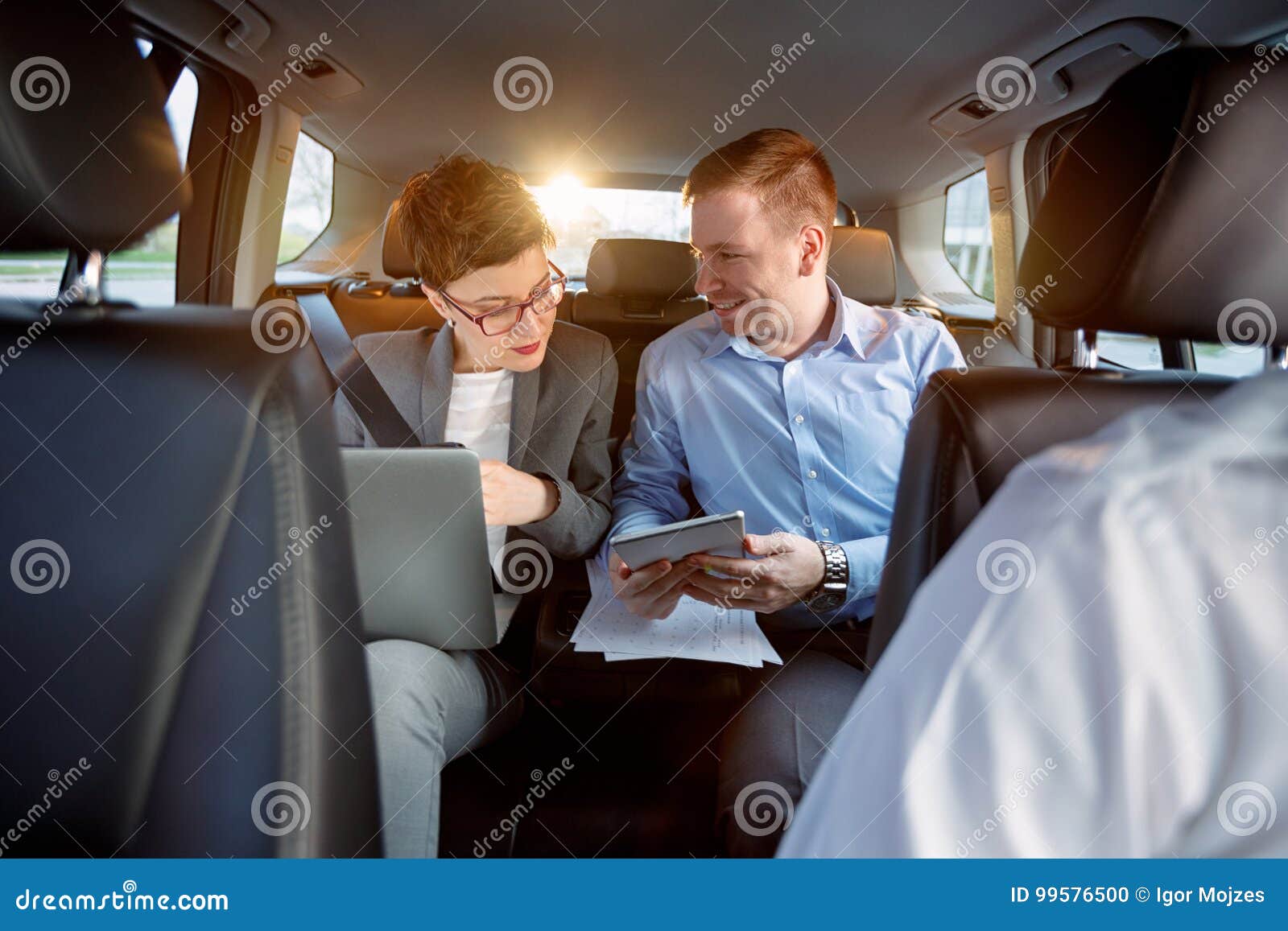 business team in the car on business trip