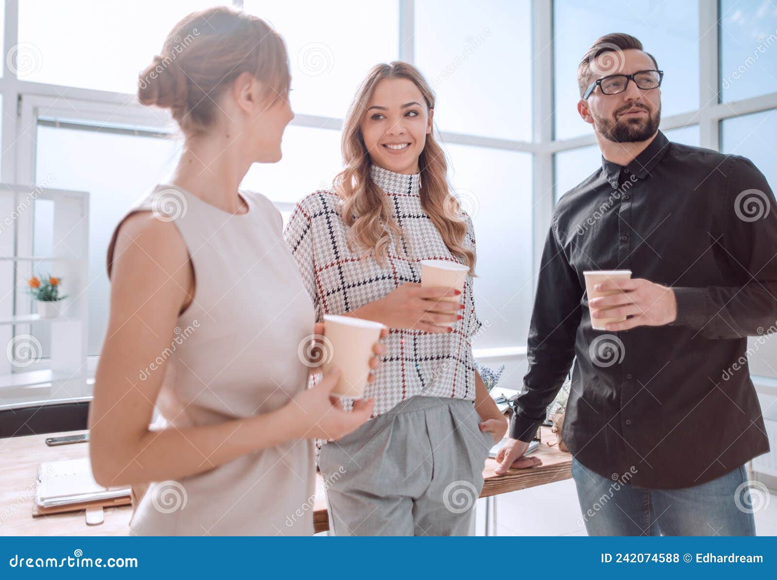 Business Team is Discussing Something during the Coffee Break Stock