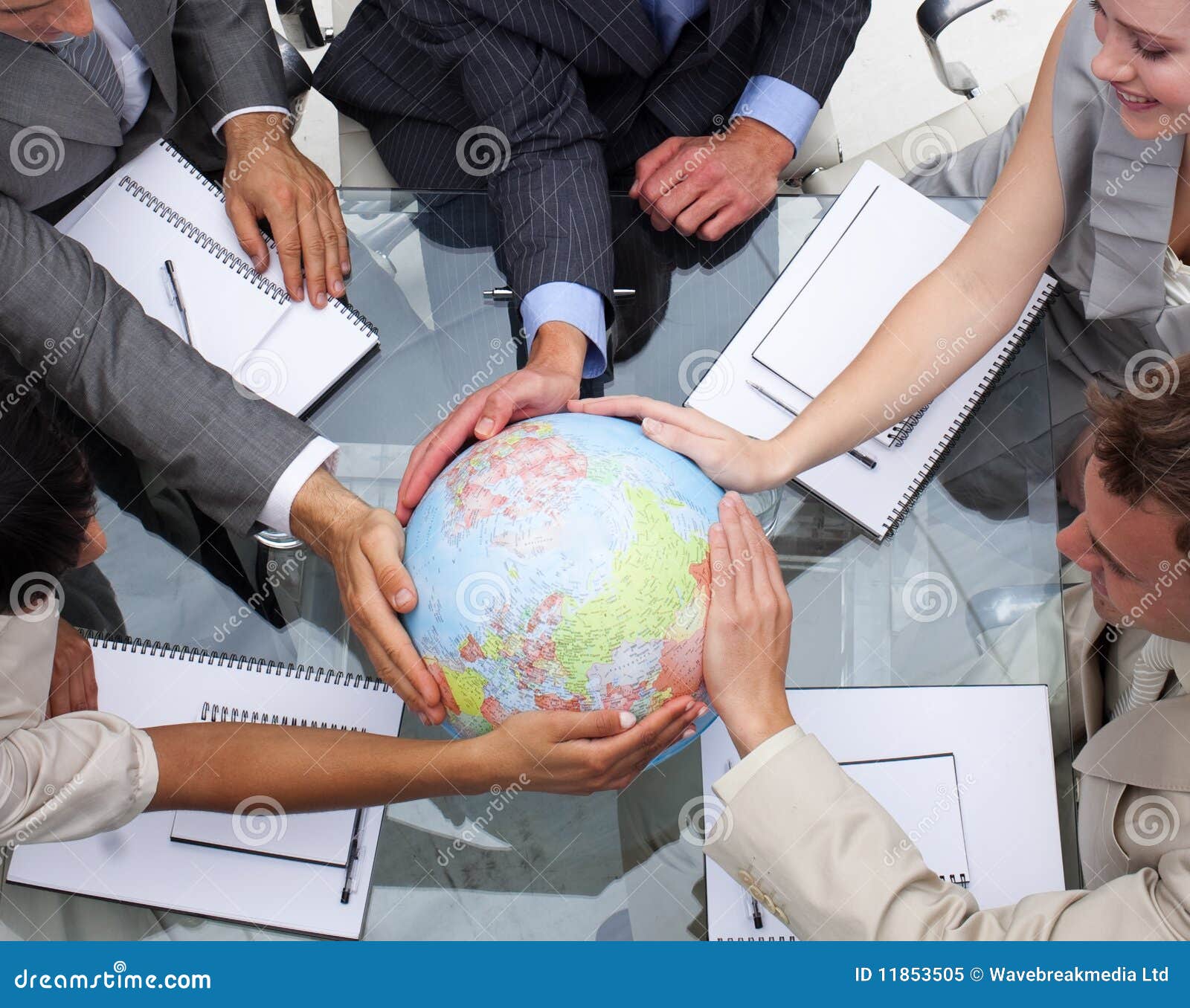 business team holding a terrestrial globe