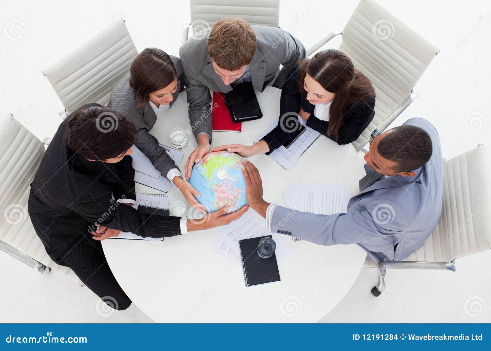 business team holding a terrestrial globe