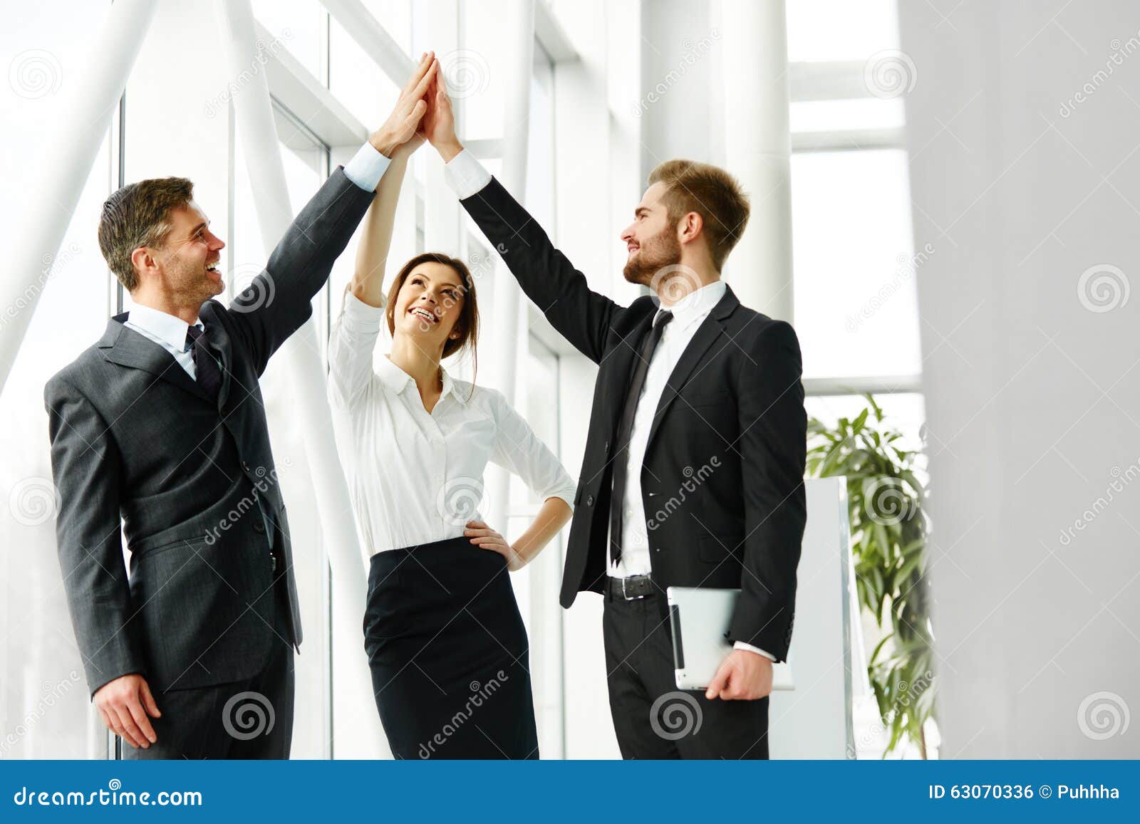 business team. successful business people celebrating a deal