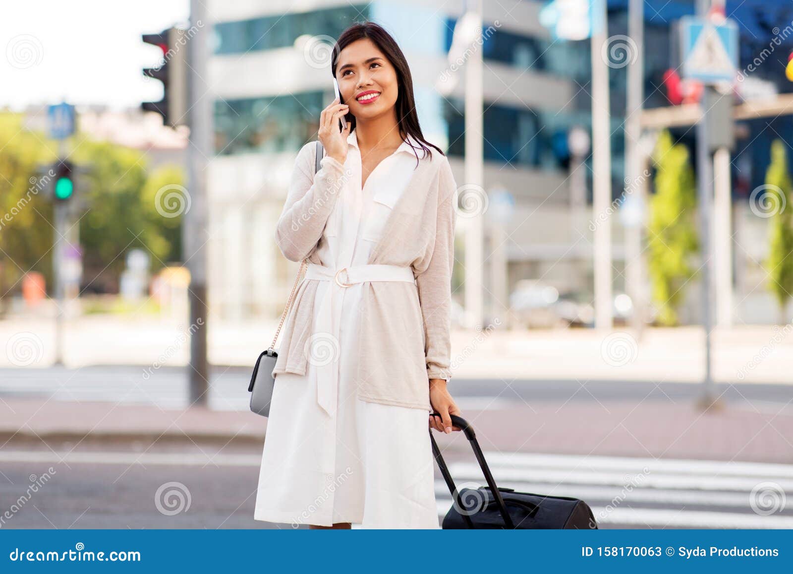 Woman with Travel Bag Calling on Cellphone in City Stock Image - Image ...