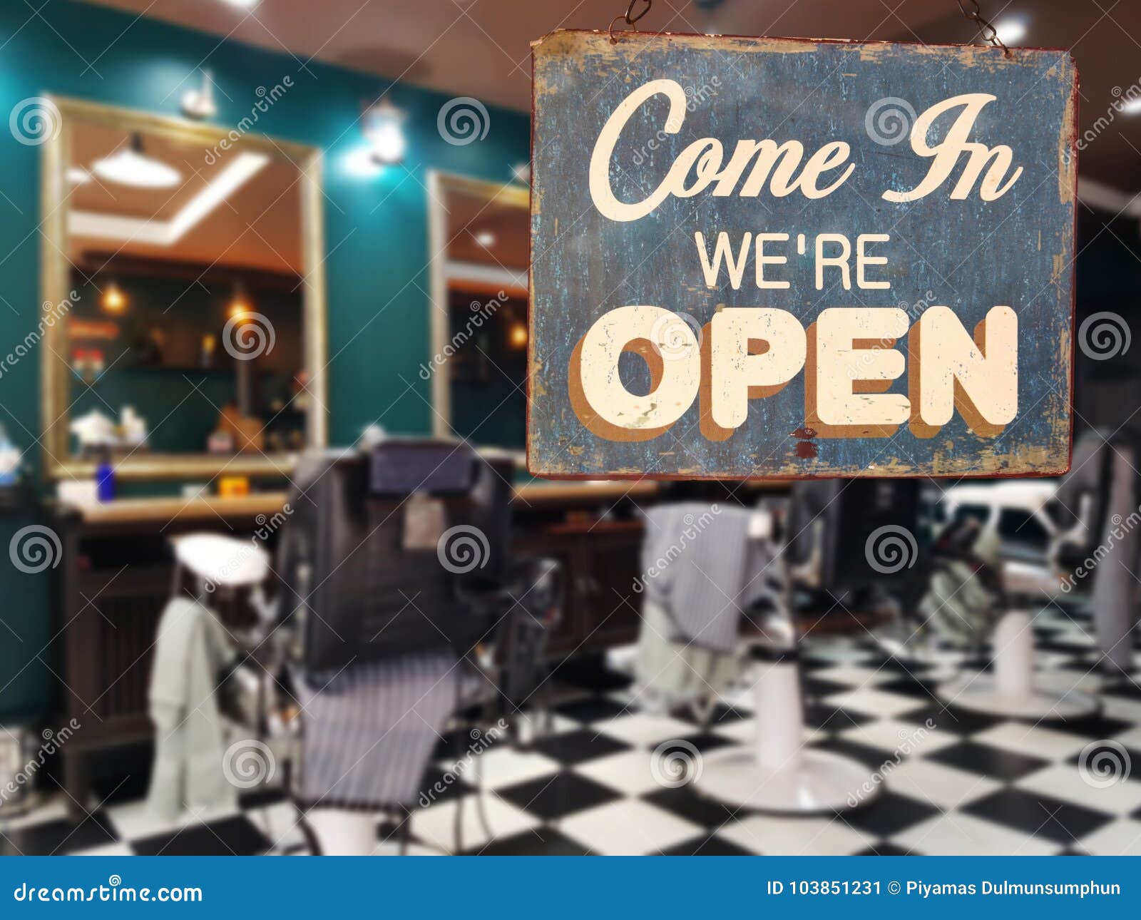 a business vintage sign that says `come in we`re open` on barber