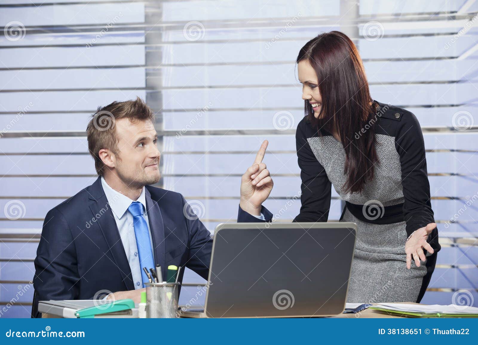 Business Woman Flirting With A Man In The Office Stock