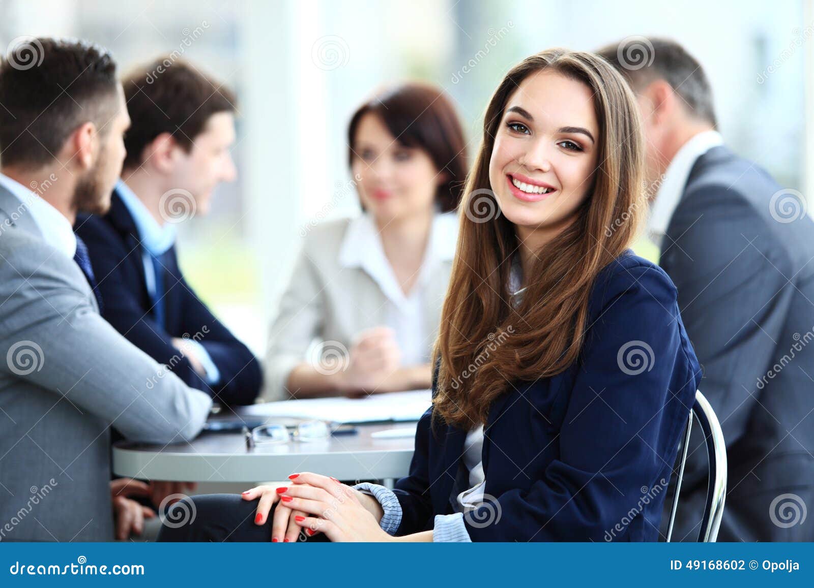 business woman with her staff, people group in background