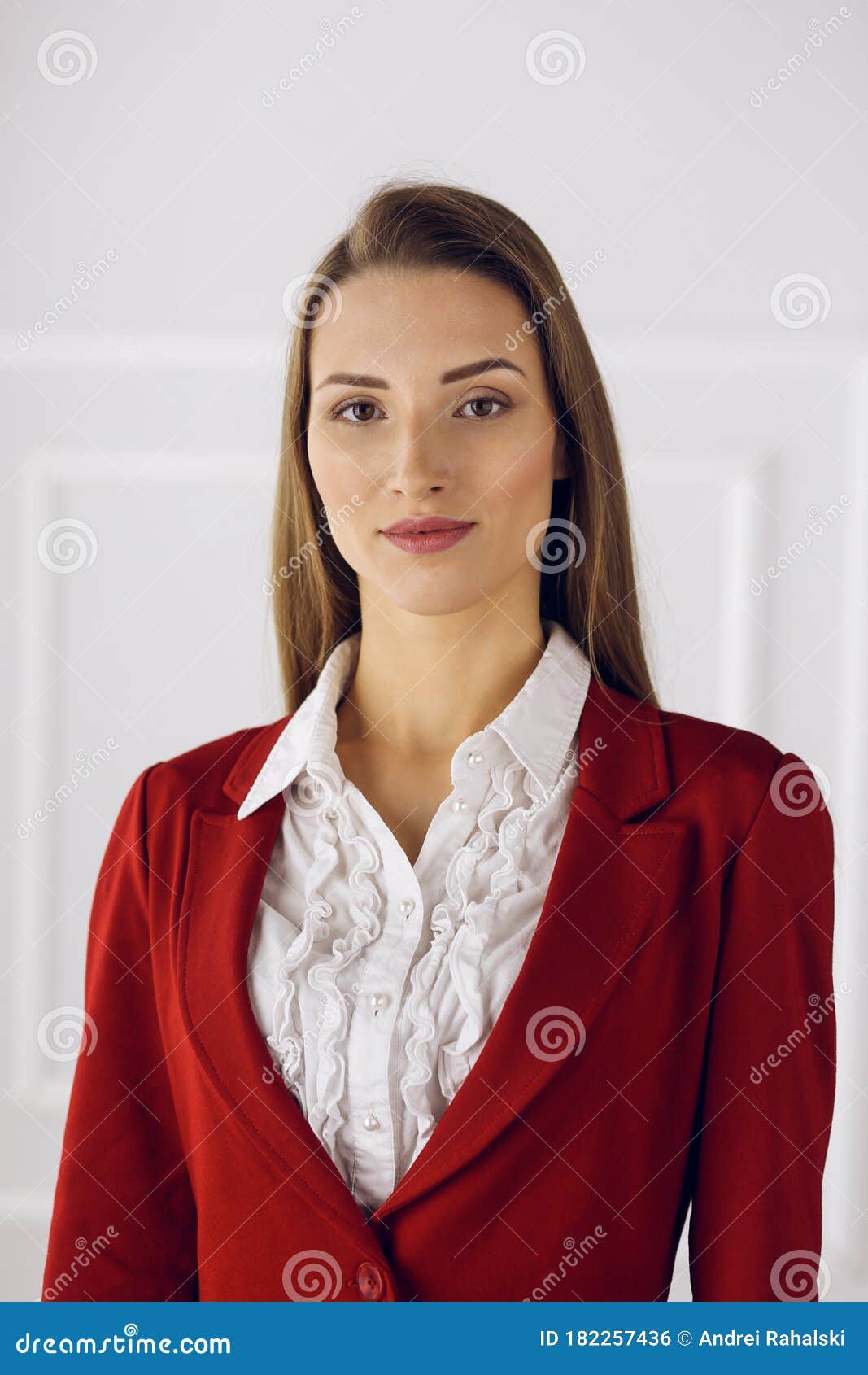 Business Woman in Red Standing at Modern Office. Headshot of a Young ...
