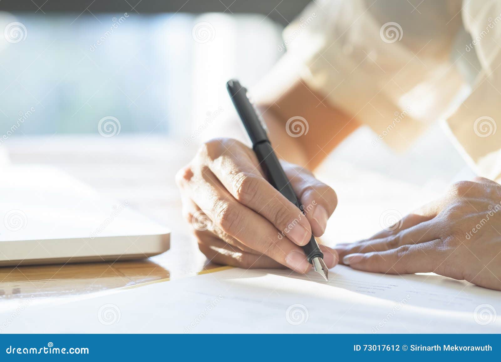 business woman signing a contract document making a deal.