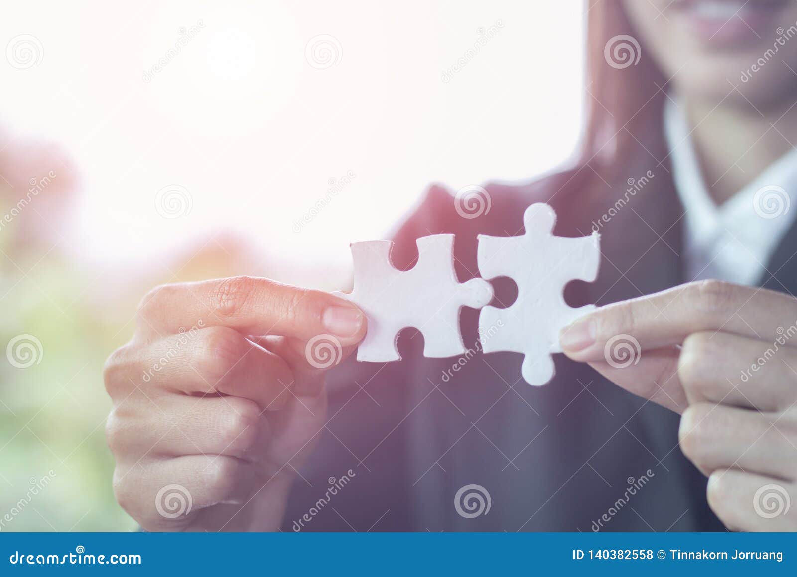 business woman is trying to connect couple puzzle piece.  of association and connection. concept of business strategy